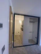 White interior with a black frontage, fully utilizing a deep alcove